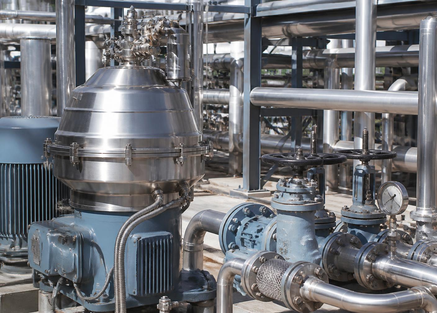 Centrifugal separation equipment with pumps, valves, and process piping